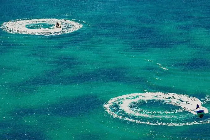 Self-drive Reef Rider boats anchored over Cades Reef during an antigua and barbuda snorkeling tour off the west coast near Five Islands Village